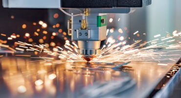 CNC Laser cutting of metal, modern industrial technology.