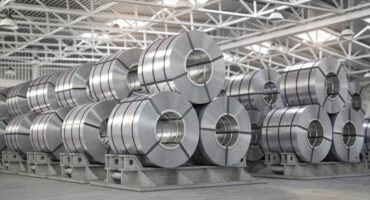 Rolls of metal sheet. Zinc, aluminium or steel sheet rolls on warehouse in factory.